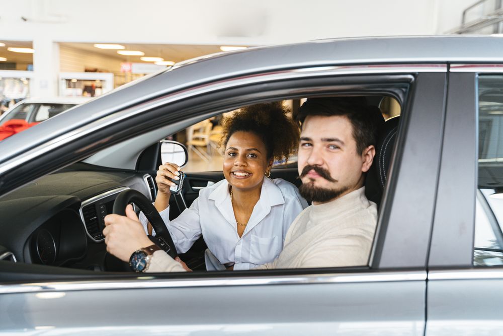 A new driver holding their car keys after passing